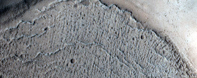 North-Pole-Facing Deposit in Crater Associated with Headwall Erosion