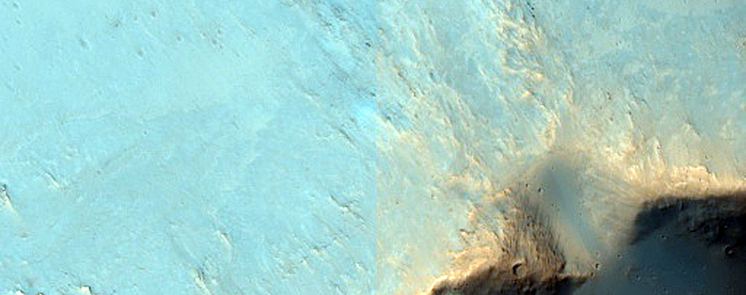 Possible Phyllosilicates Exposed by Terra Cimmeria Impact Crater