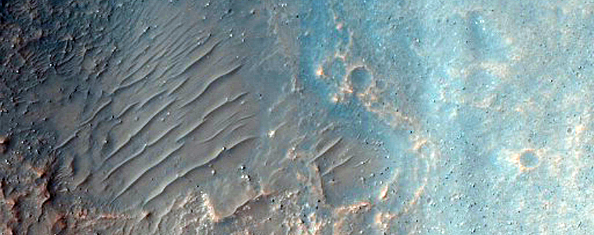 Layered Crater Wall Material in Mouth of Kasei Valles