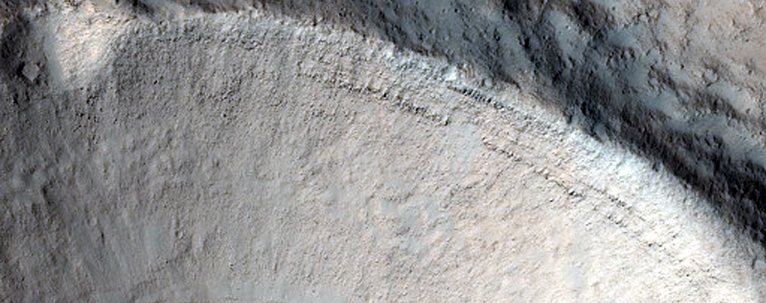 North-Pole-Facing Deposit in Crater Associated with Headwall Erosion