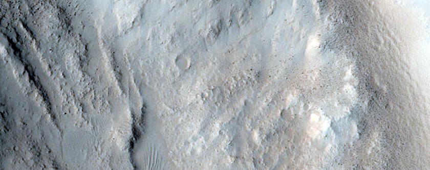North-Pole-Facing Deposit in Crater Associated with Headwall Erosion