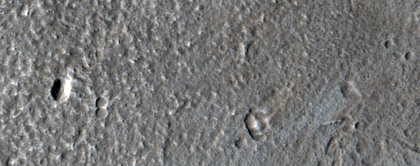 North-Pole-Facing Deposit in Crater Associated with Headwall Erosion