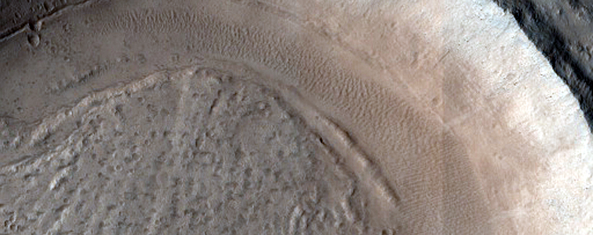 North-Pole-Facing Deposit in Crater Associated with Headwall Erosion