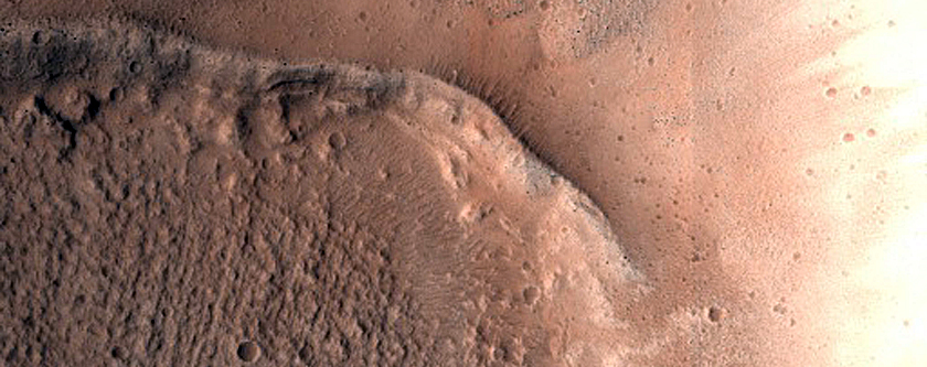 North-Pole-Facing Deposit in Crater Associated with Headwall Erosion