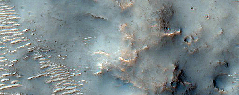 Channel Interacting with Ejecta in Tyrrhena Terra