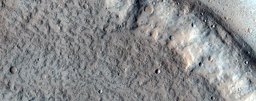 North-Pole-Facing Deposit in Crater Associated with Headwall Erosion