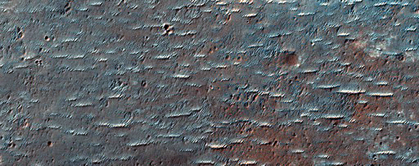 Crater with Dark Ejecta East of Huygens Crater