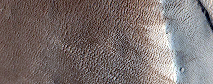 North-Pole-Facing Deposit in Crater Associated with Headwall Erosion