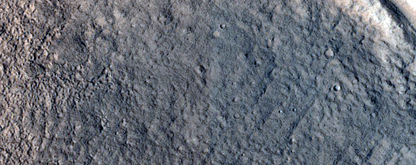 North-Pole-Facing Deposit in Crater Associated with Headwall Erosion