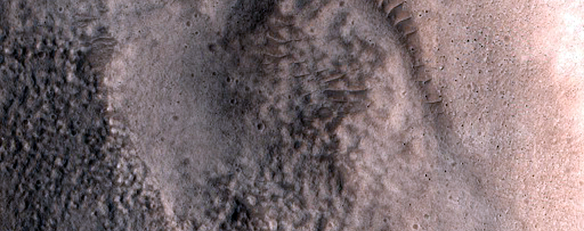North-Pole-Facing Deposit in Crater Associated with Headwall Erosion