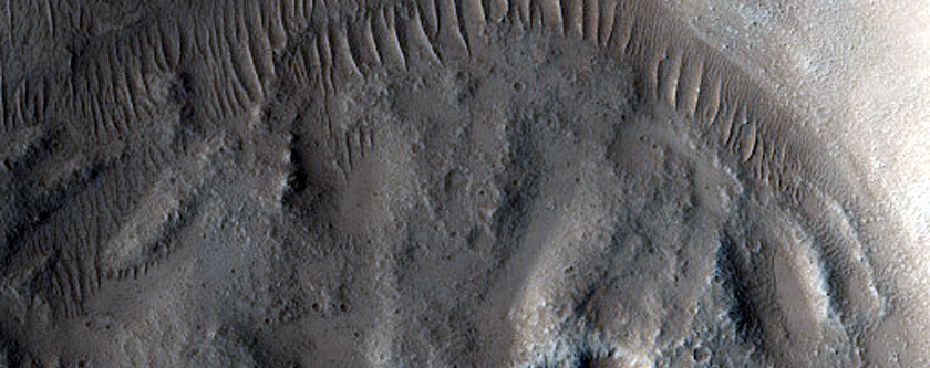 North-Pole-Facing Deposit in Crater Associated with Headwall Erosion
