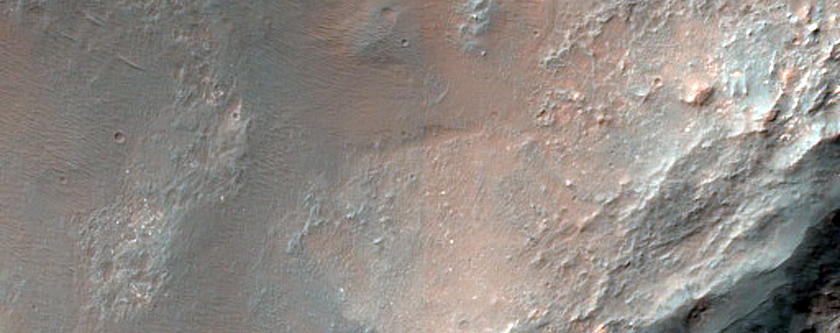 Impact Crater with Central Uplift and Bedrock Exposures