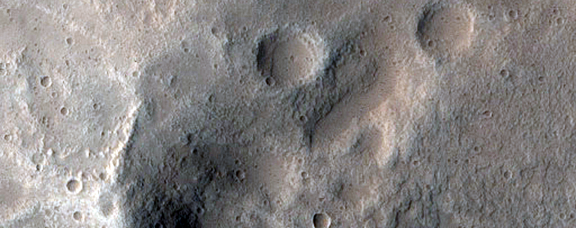 North-Pole-Facing Deposit in Crater Associated with Headwall Erosion