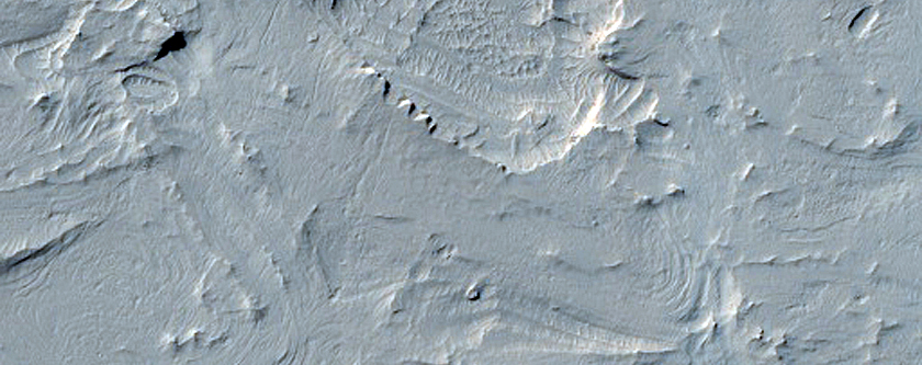 Layering in Sinuous Terrain