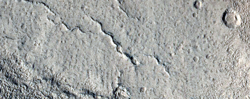 North-Pole-Facing Deposit in Crater Associated with Headwall Erosion