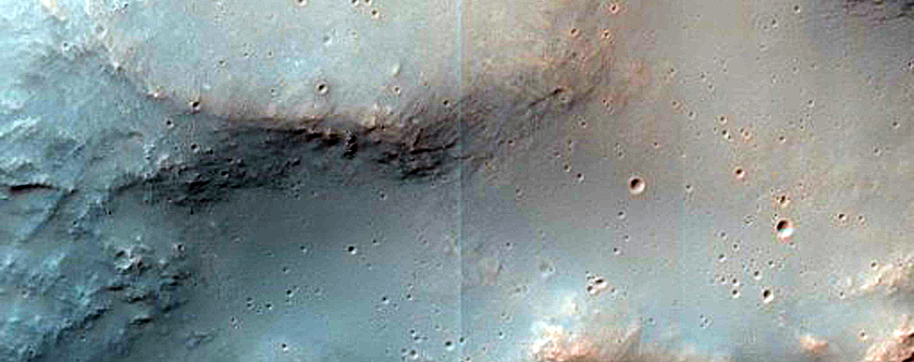 Impact Crater Exposing Bedrock