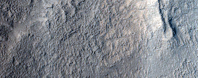 Terrain around Crater in Erebus Montes