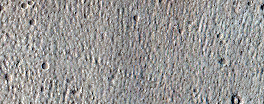 North-Pole-Facing Deposit in Crater Associated with Headwall Erosion