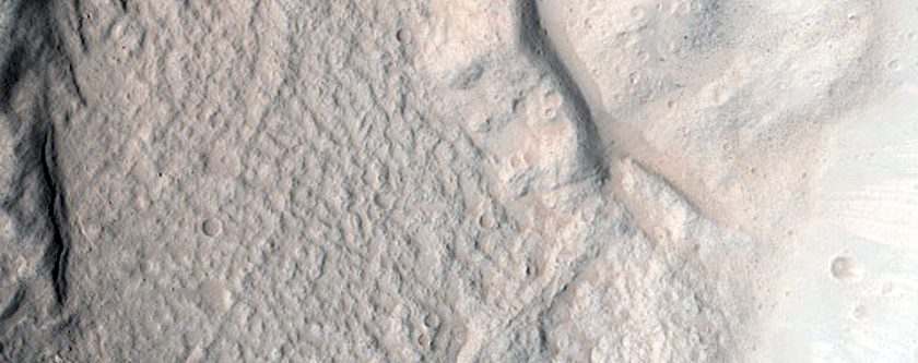 North-Pole-Facing Deposit in Crater Associated with Headwall Erosion