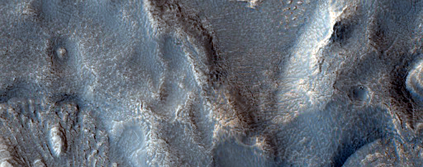 Dipping Layers in Depression in Crater Rim in Deuteronilus Mensae