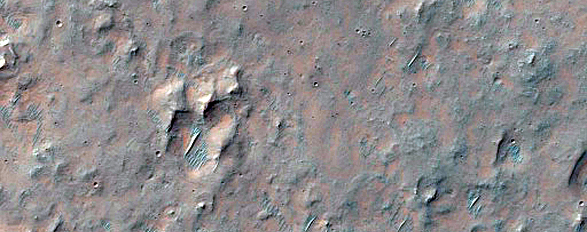 Possible Olivine-Rich Materials on Plains Southeast of Martin Crater