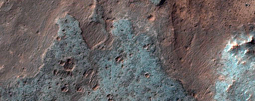 Light-Toned Deposits in Crater South of Coprates Chasma