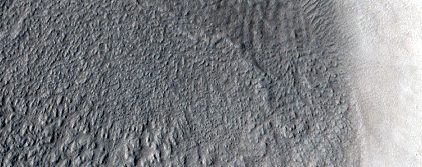 North-Pole-Facing Deposit in Crater Associated with Headwall Erosion