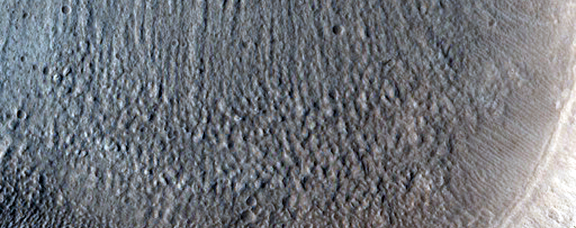 North-Pole-Facing Deposit in Crater Associated with Headwall Erosion