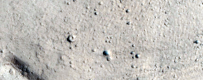 Crater with Glacier Fill and Contrasting Ejecta