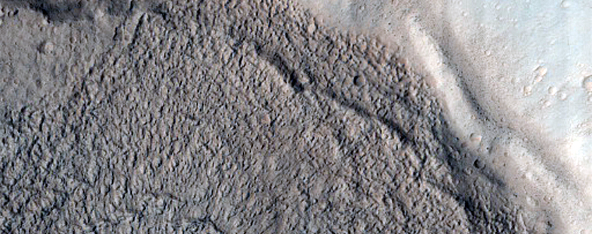 North-Pole-Facing Deposit in Crater Associated with Headwall Erosion
