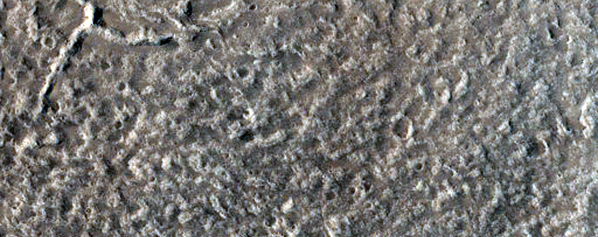 North-Pole-Facing Deposit in Crater Associated with Headwall Erosion