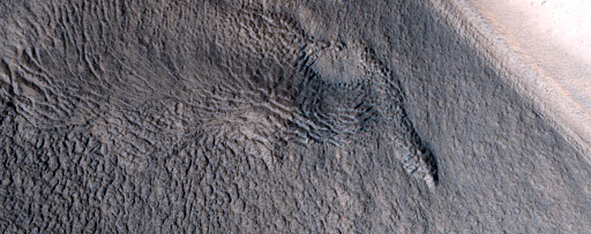 North-Pole-Facing Deposit in Crater Associated with Headwall Erosion