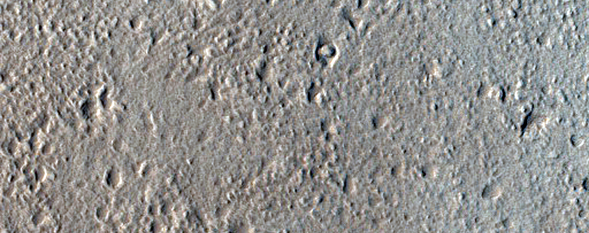 North-Pole-Facing Deposit in Crater Associated with Headwall Erosion