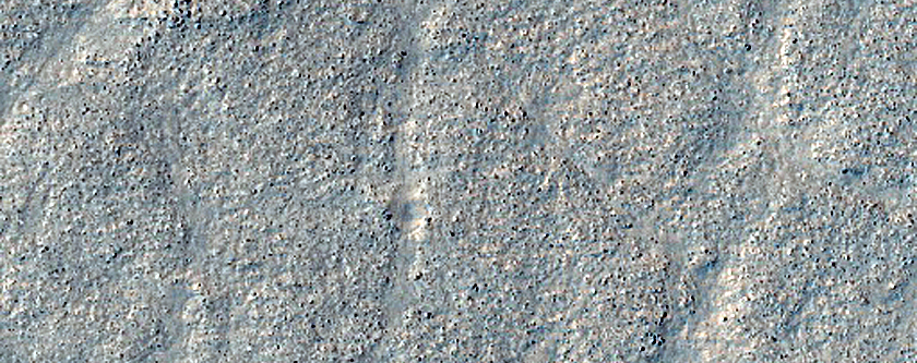 Layered Features in Small Craters in Deuteronilus Mensae