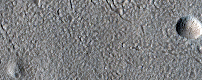 North-Pole-Facing Deposit in Crater Associated with Headwall Erosion