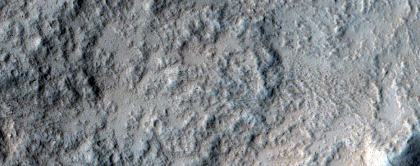 North-Pole-Facing Deposit in Crater Associated with Headwall Erosion