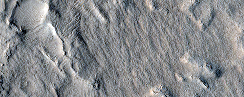 Terrain around Crater in Erebus Montes