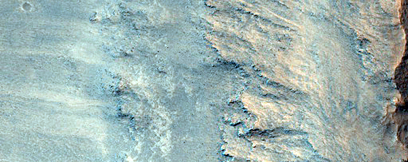 Layered Bedrock Exposed in Crater Wall on Antoniadi Crater Floor