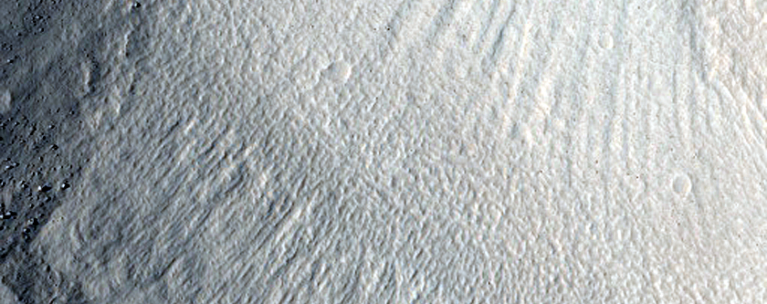 North-Pole-Facing Deposit in Crater Associated with Headwall Erosion