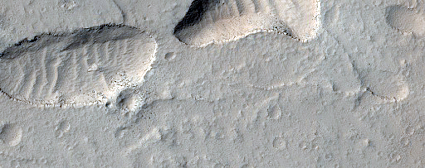 Pits in Sacra Sulci
