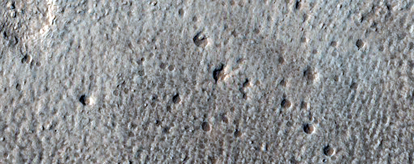North-Pole-Facing Deposit in Crater Associated with Headwall Erosion