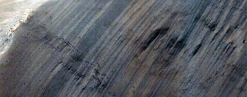 Channel Entering Northern Mid-Latitude Crater
