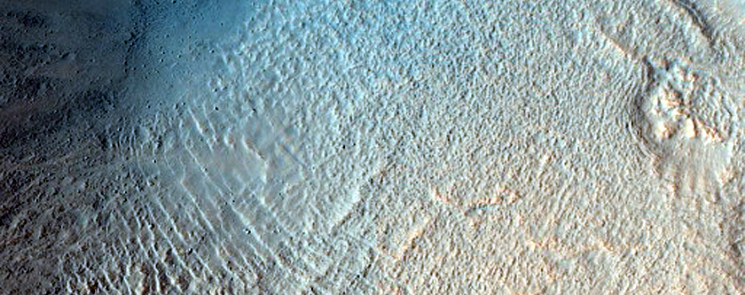 Steep Crater Intersecting Mesa in Acidalia Planitia with Lobate Deposit