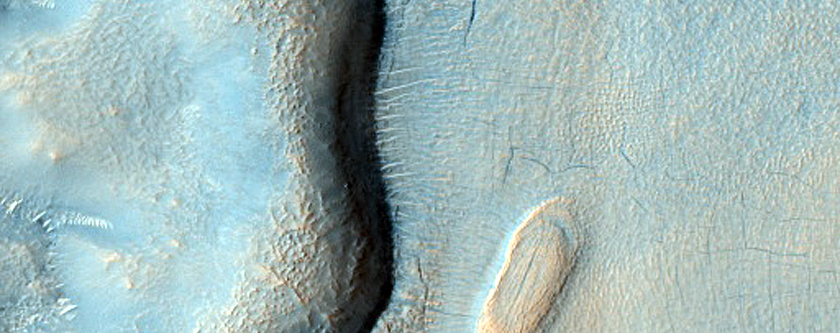 Layered Features in Craters in Northern Mid-Latitudes