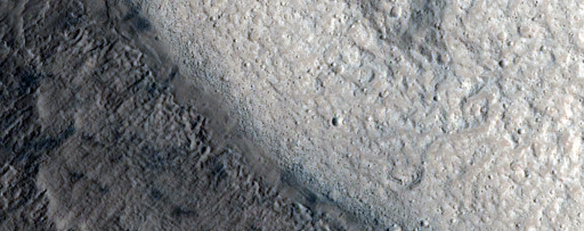 Pole-Facing Deposit in 10-Kilometer Crater