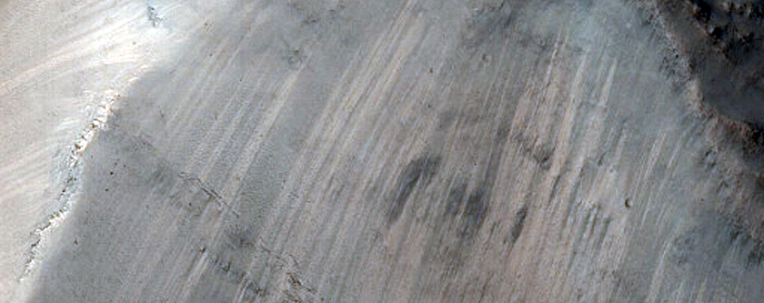 Channel Entering Northern Mid-Latitude Crater