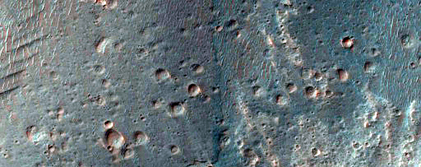 Alluvial Fan and Light-Toned Deposits in Coprates Catena Trough
