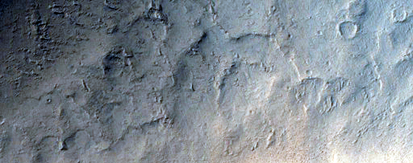 Impact-Related Deposits and Flows Southeast of Pettit Crater