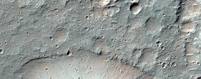 Flow-Like Deposit Associated with Molesworth Crater Peak-Ring Structure