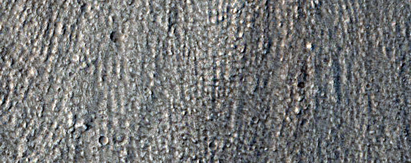 North-Pole-Facing Deposit in Crater Associated with Headwall Erosion